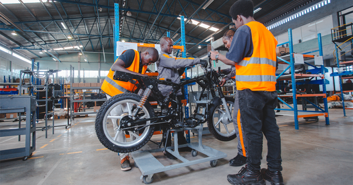 Mechanics working on e-bike in workshop