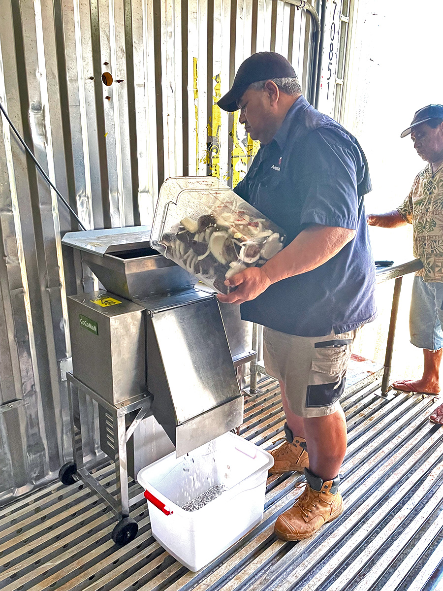 Processing coconuts for coconut milk in Motu Juice's 'Factory in a Box', Tonga